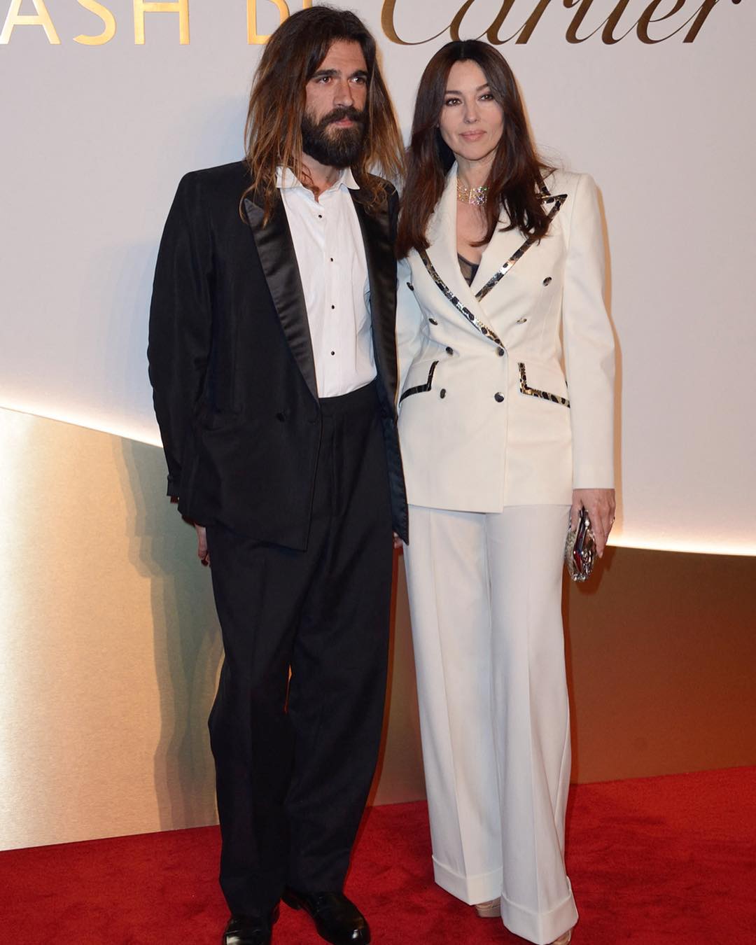 Моніка Беллуччі на вечірці Cartier: у костюмі Dolce & Gabbana і під руку з коханим