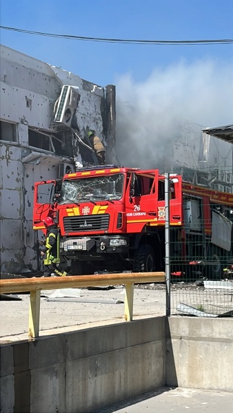 Rescuers hit in Ukraine as Russia makes second strike on retailer's distribution hub