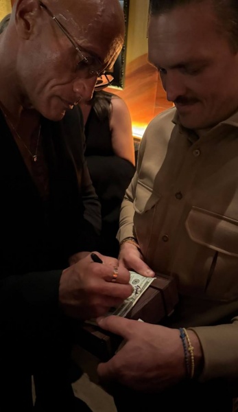 Boxing champ Usyk debuts in cinema — Fans cheer as he poses with The Rock