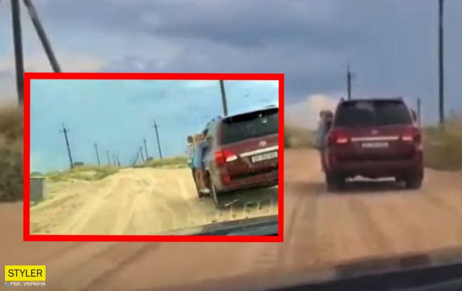 В Кирилловке водитель внедорожника устроил опасное развлечение с детьми (видео)