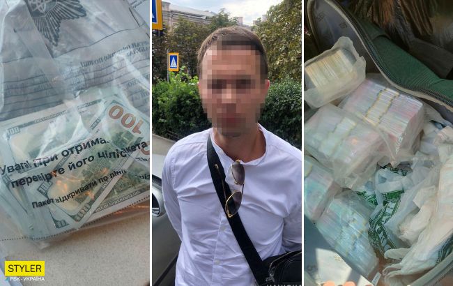 Киевлянину обменяли 28 тысяч долларов на сувенирные гривны (видео)