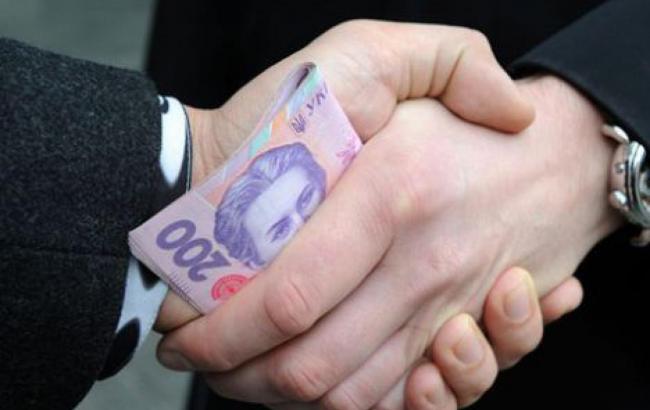 В Полтавской области двух полицейских задержали за вымогательство тысячи долларов