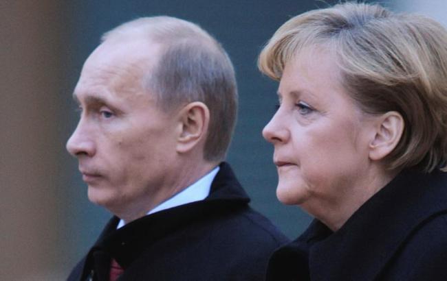 Путін і Меркель домовилися сприяти мирному врегулюванню конфлікту в Україні