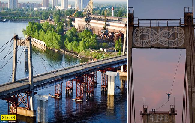 "Паблик спэйс": киевлянин прогулялся по тросу на верхушке аварийного Рыбальского моста