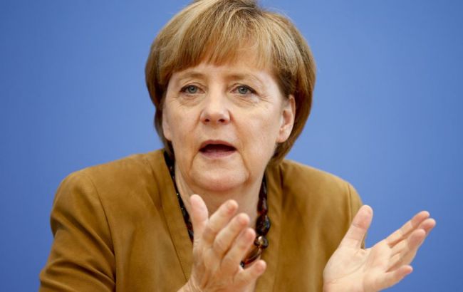 Бундестаг: Меркель хотела бы снять антироссийские санкции, "скорее, сегодня, чем завтра"
