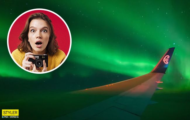 Пролетая над Исландией: пассажир заснял впечатляющее северное сияние из окна самолета