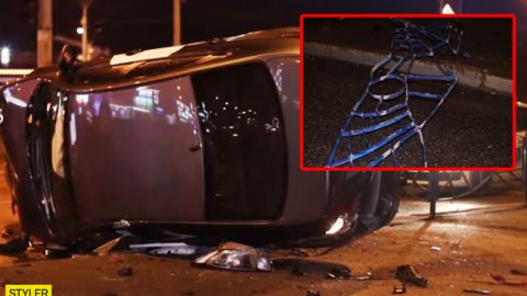 В Киеве таксист снес 15 метров забора и "сел" на бок: видео