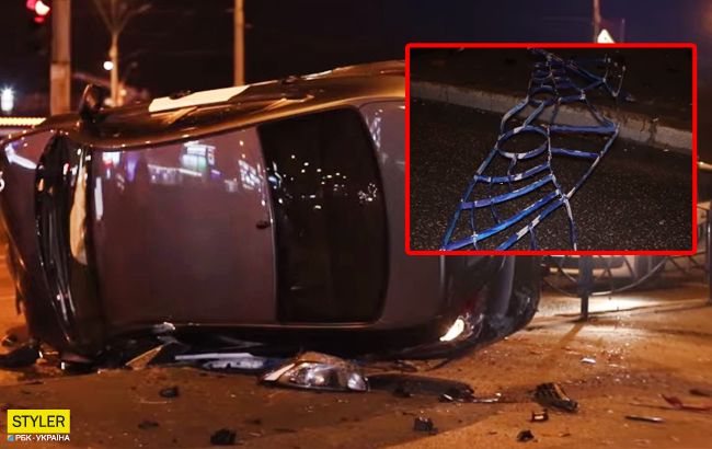 В Киеве таксист снес 15 метров забора и "сел" на бок: видео