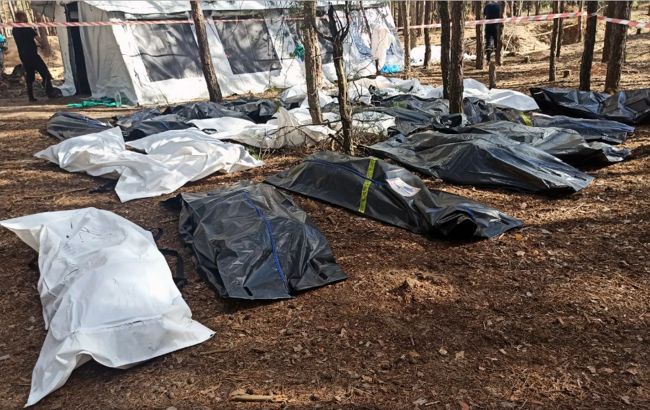 В Ізюмі знайшли вже більше 260 тіл катованих, в тому числі двох дітей (фото)
