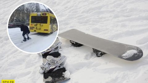 В Киеве парень зацепился за троллейбус и ехал на сноуборде по дороге (видео)