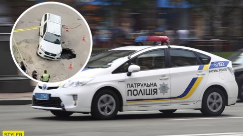 В Киеве внедорожник провалился под асфальт в яму: видео инцидента