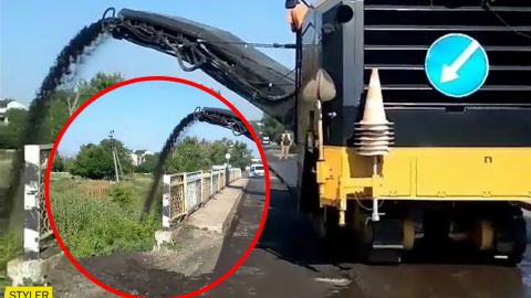 На Запорожье рабочие высыпали "лишний" асфальт с моста в реку: видео инцидента