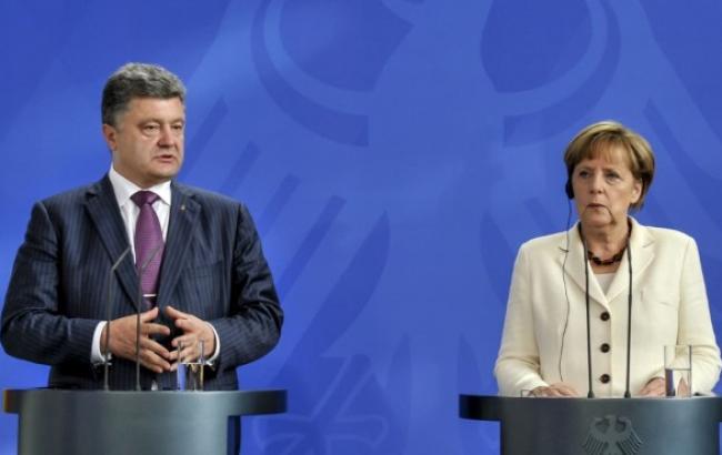 Порошенко и Меркель выступили за продолжение консультаций в минском формате