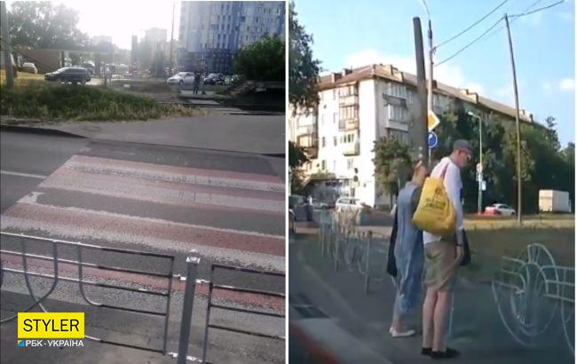 В Киеве коммунальщики перегородили пешеходный переход забором: в сети удивляются (видео)