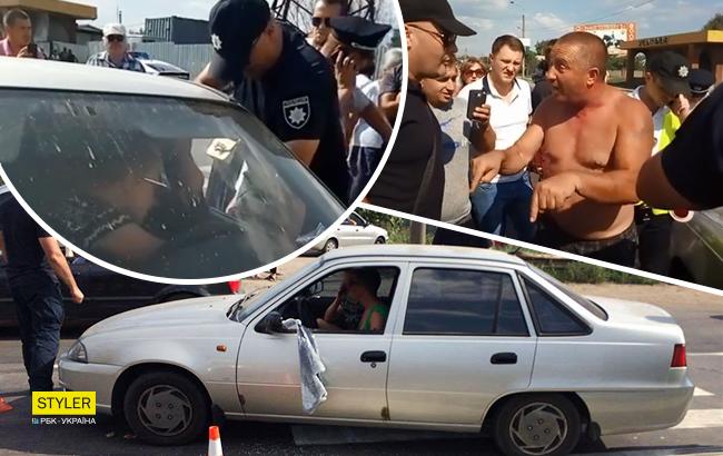 Під Одесою "копи", намагаючись затримати порушника, розбили скло в його авто і порвали одяг (фото, відео)