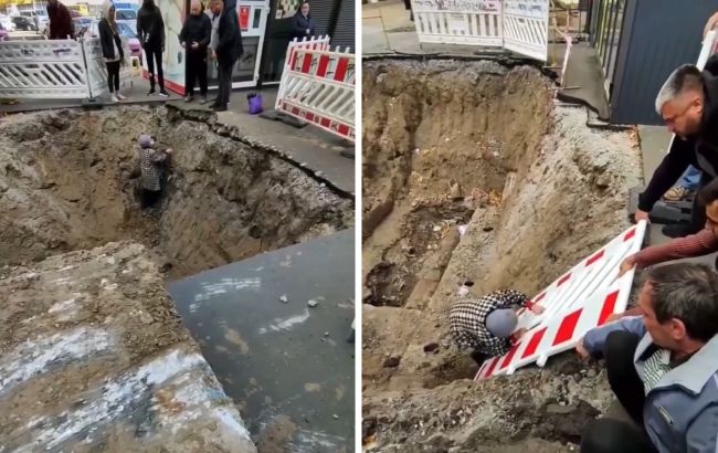В Киеве бабушка провалилась в гигантскую яму, брошенную коммунальщиками (видео)