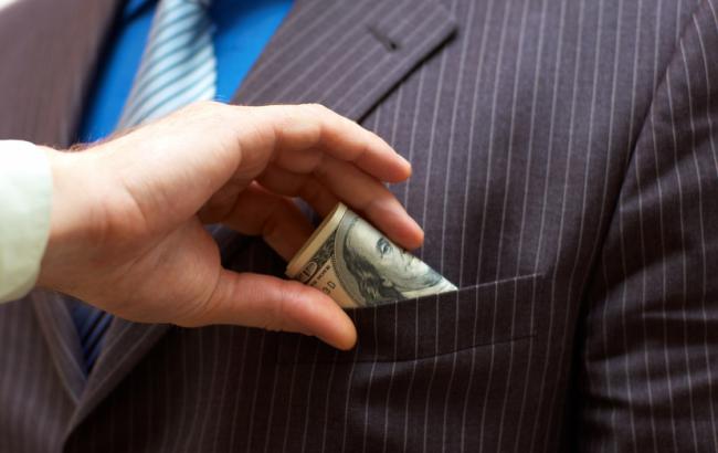 Все больше украинцев считают коррупцию широко распространенной в стране, - EY